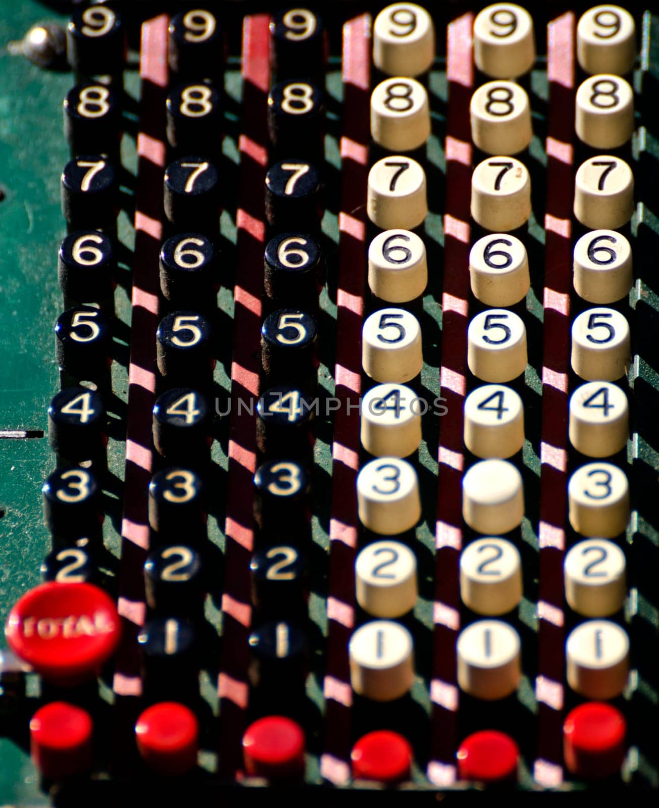 a close-up of the keys of an old calculator