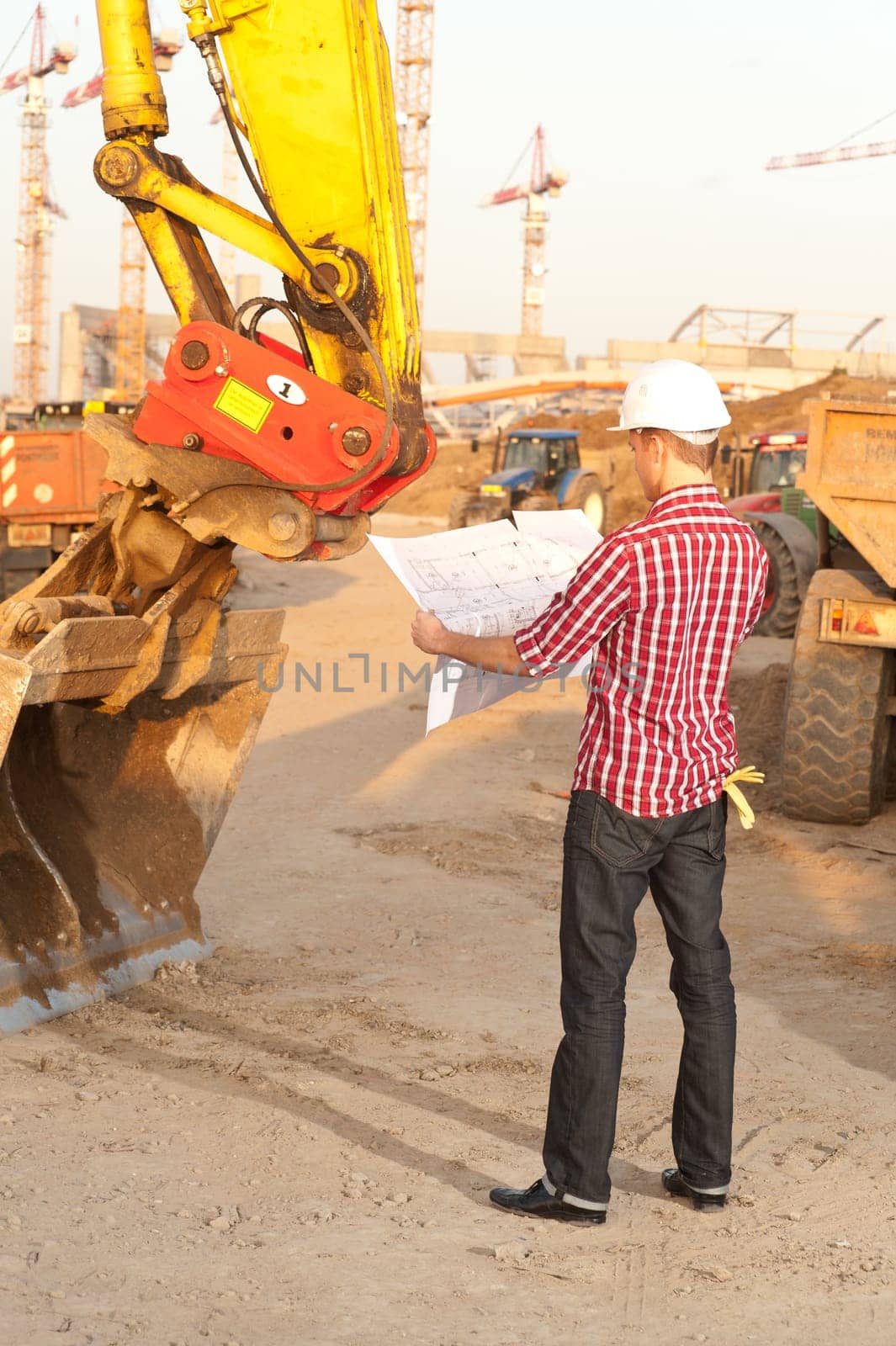 Architect working outdoors on a construction site
