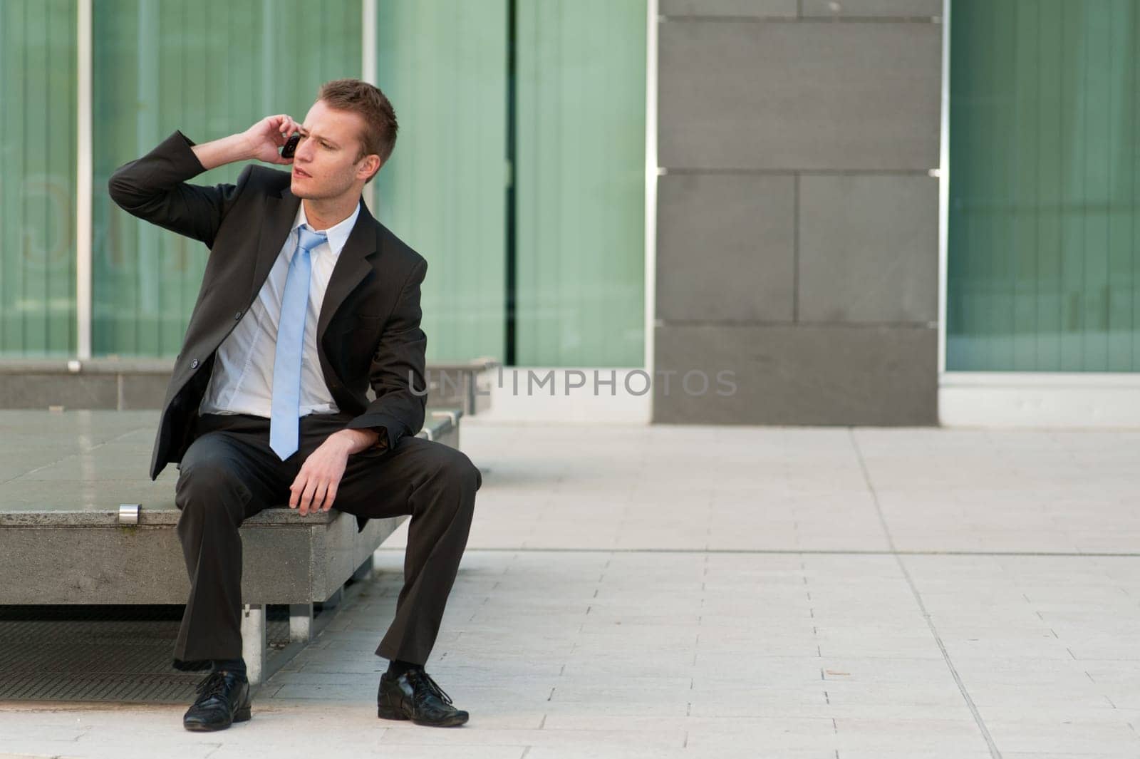 Young business man with a telephon