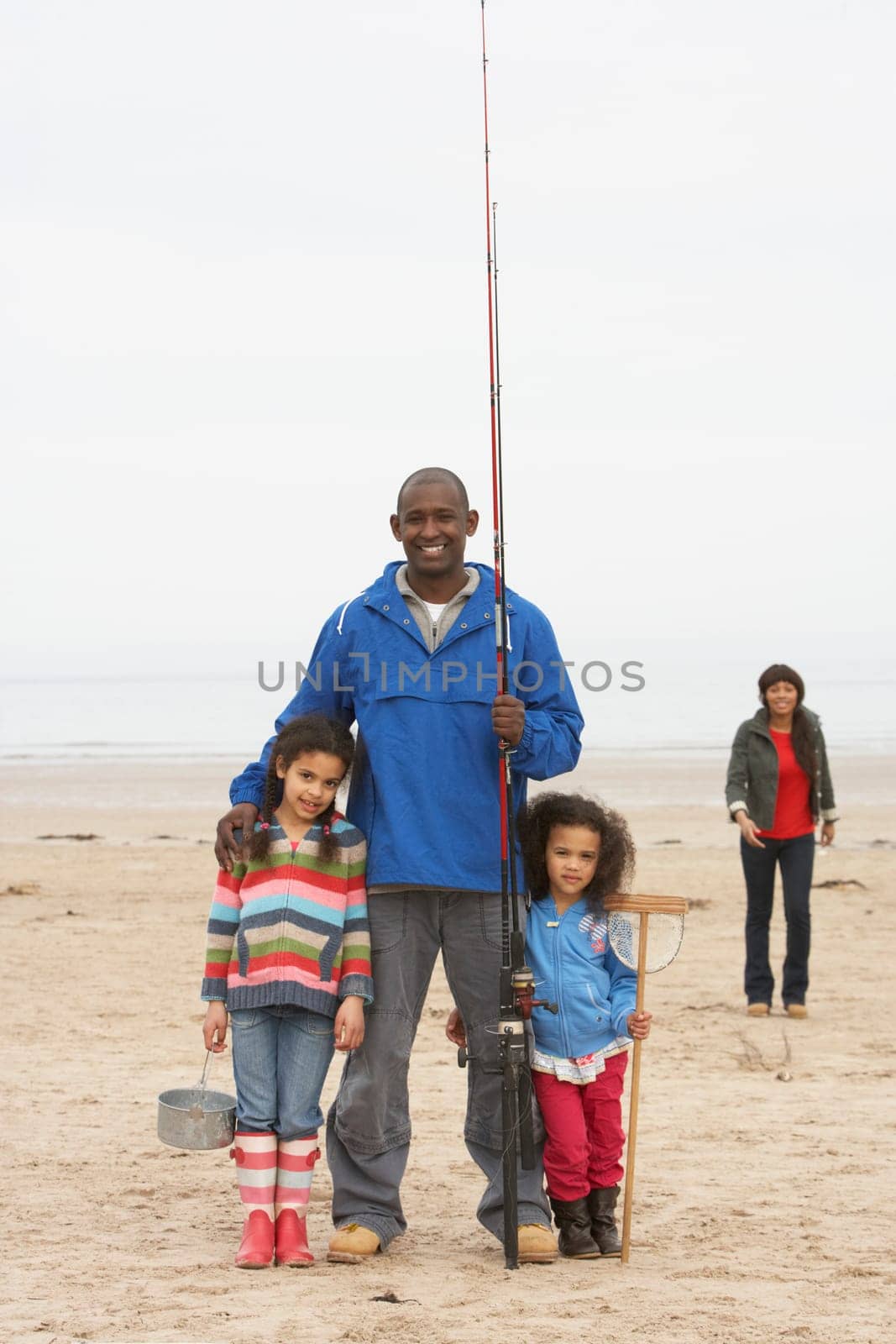 Family On Beach Fishing Trip