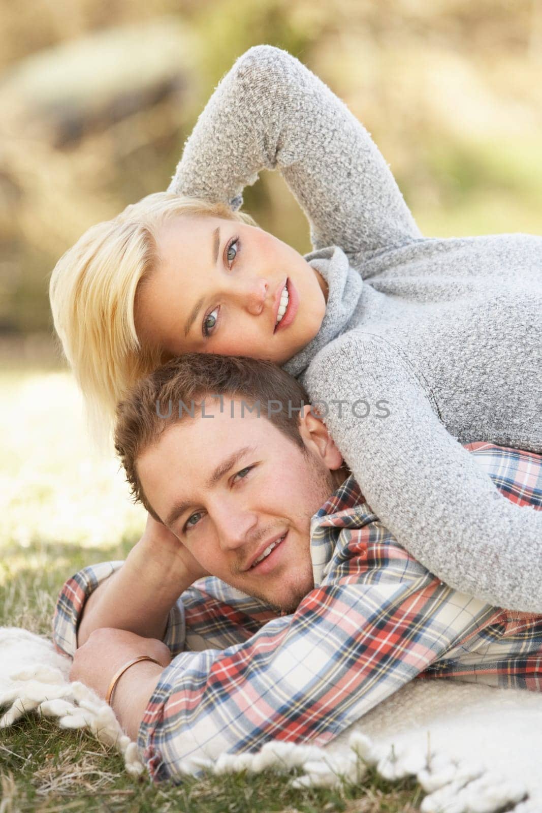 Portrait Of Romantic Young Lying On Grass
