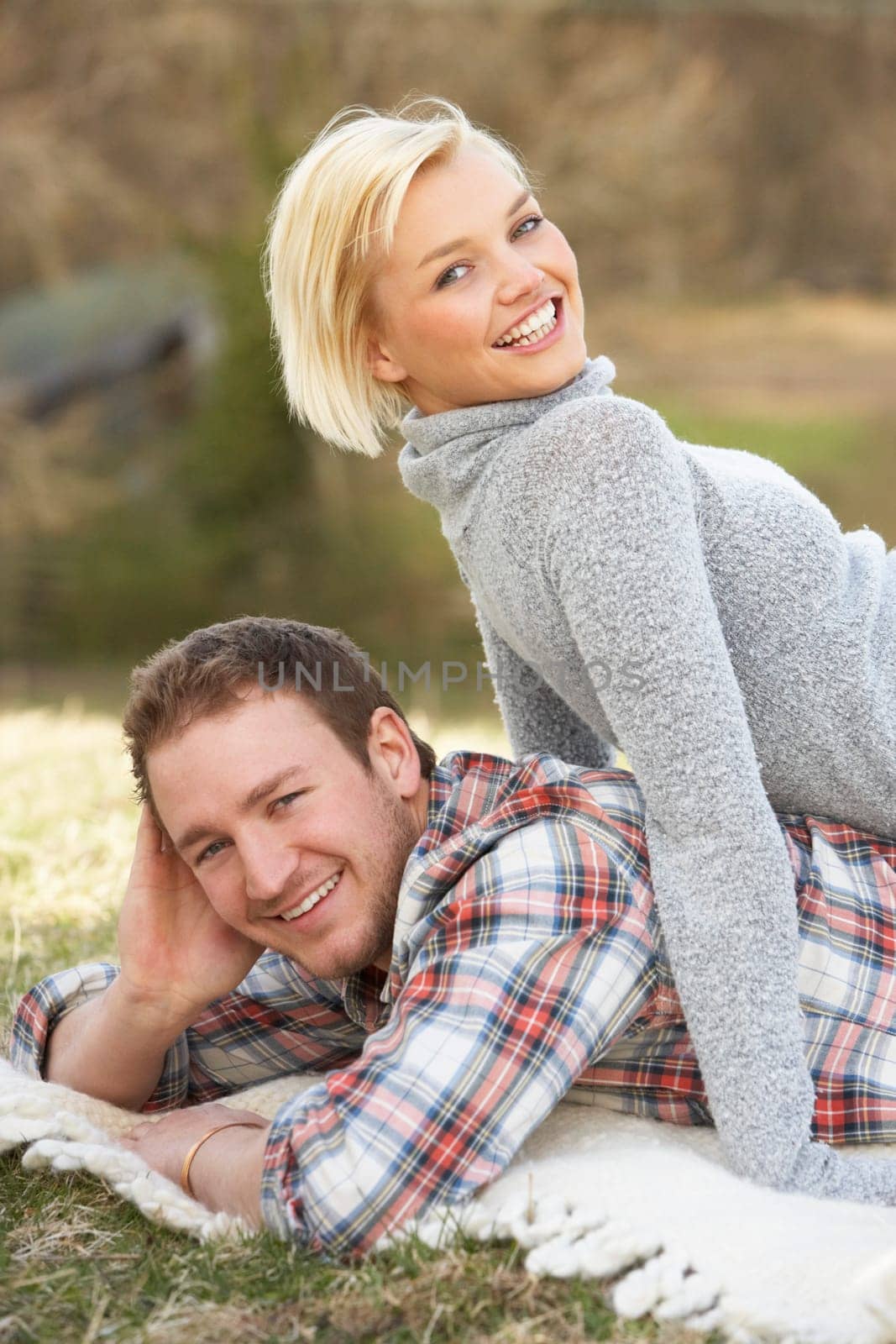 Portrait Of Romantic Young Lying On Grass
