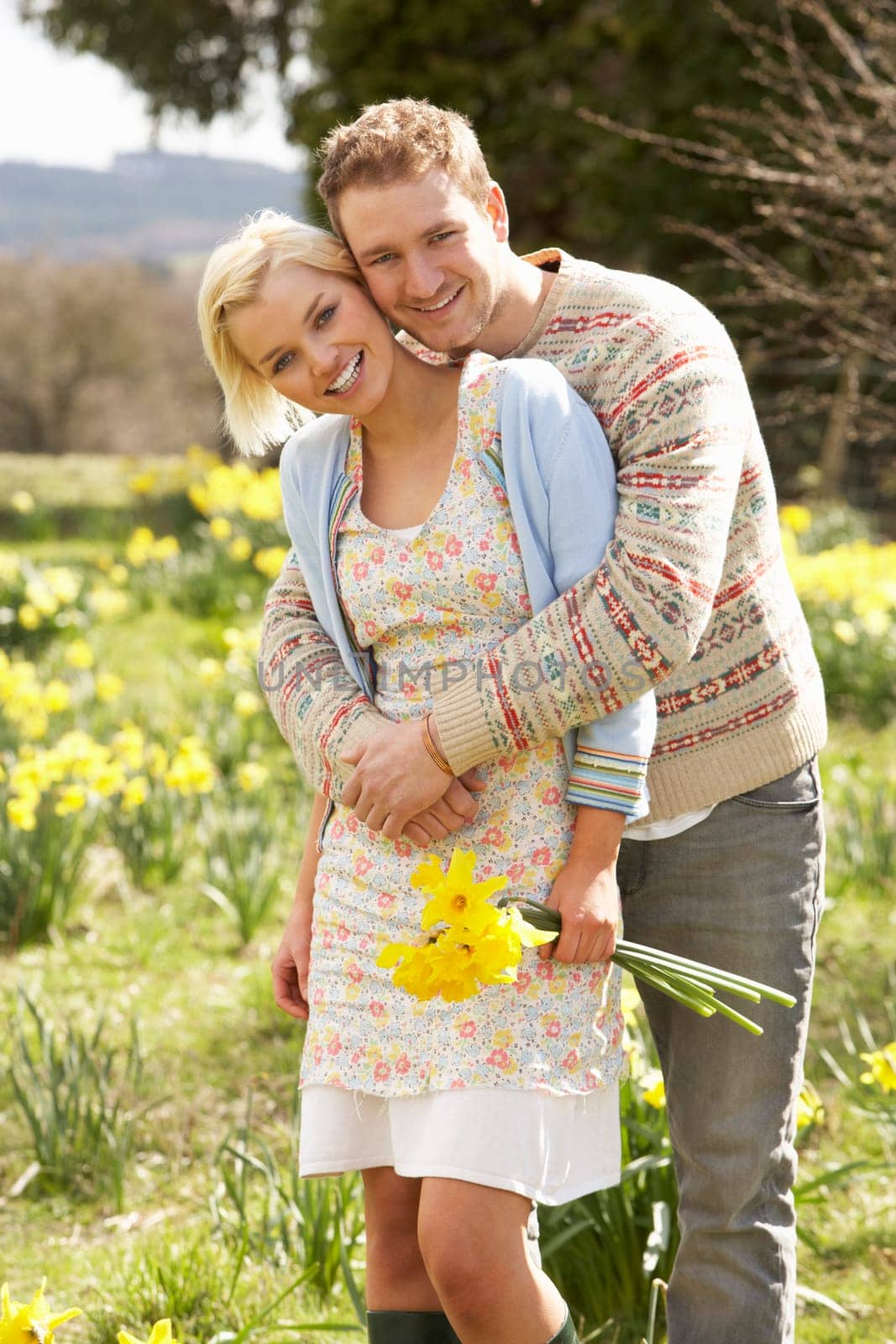 Romantic Couple Walking Amongst Spring Daffodils