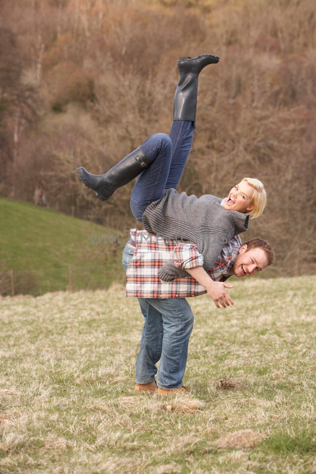 Portrait Of Energetic Young Couple Having Fun