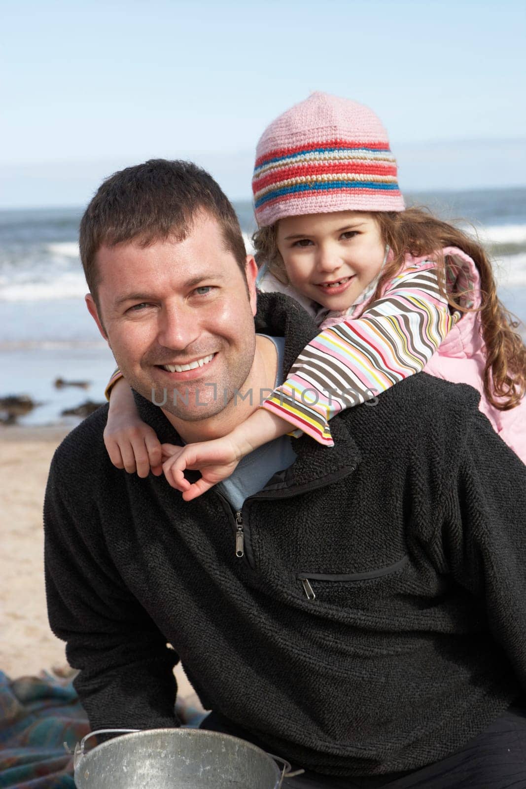 Father And Daughter Having Fun On Beach Together