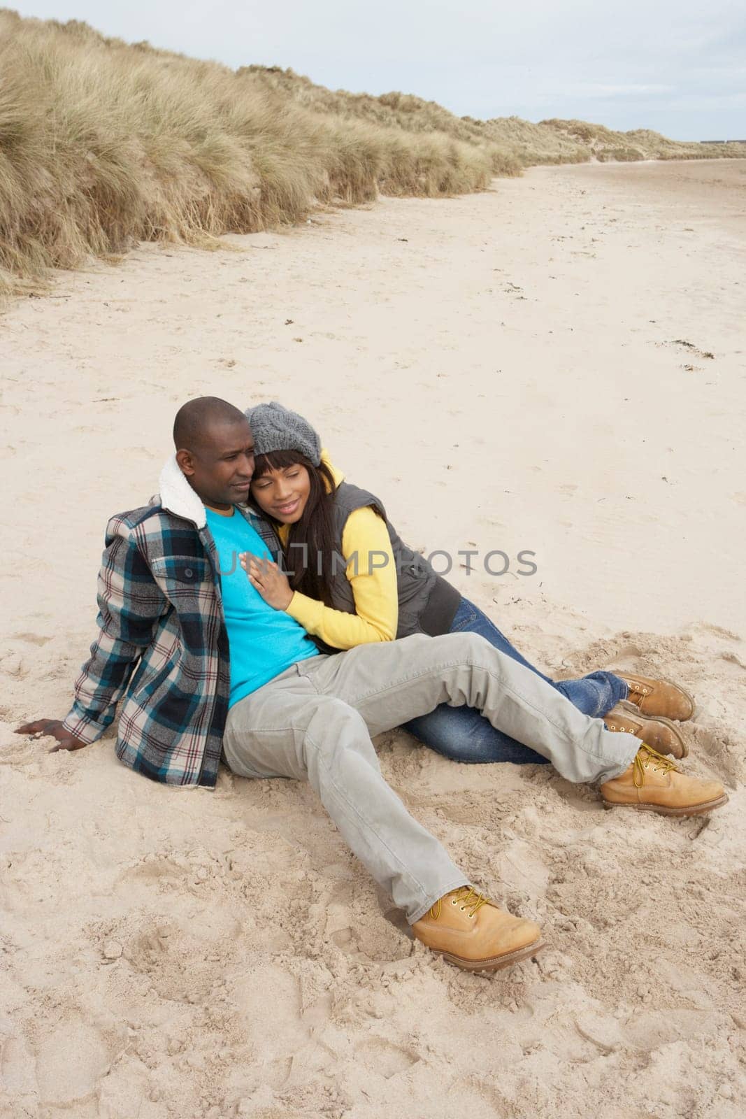 Romantic Young Couple On Winter Beach
