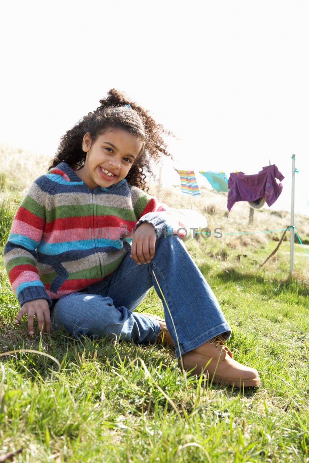Young Girl Sitting Outside In Caravan Park