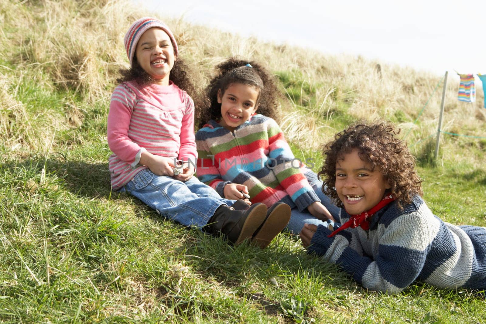 Young Children Sitting Outside In Caravan Park