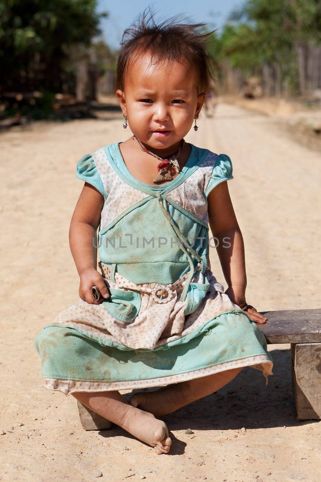 Portrait of asian child,with dirty face and poor clothes
