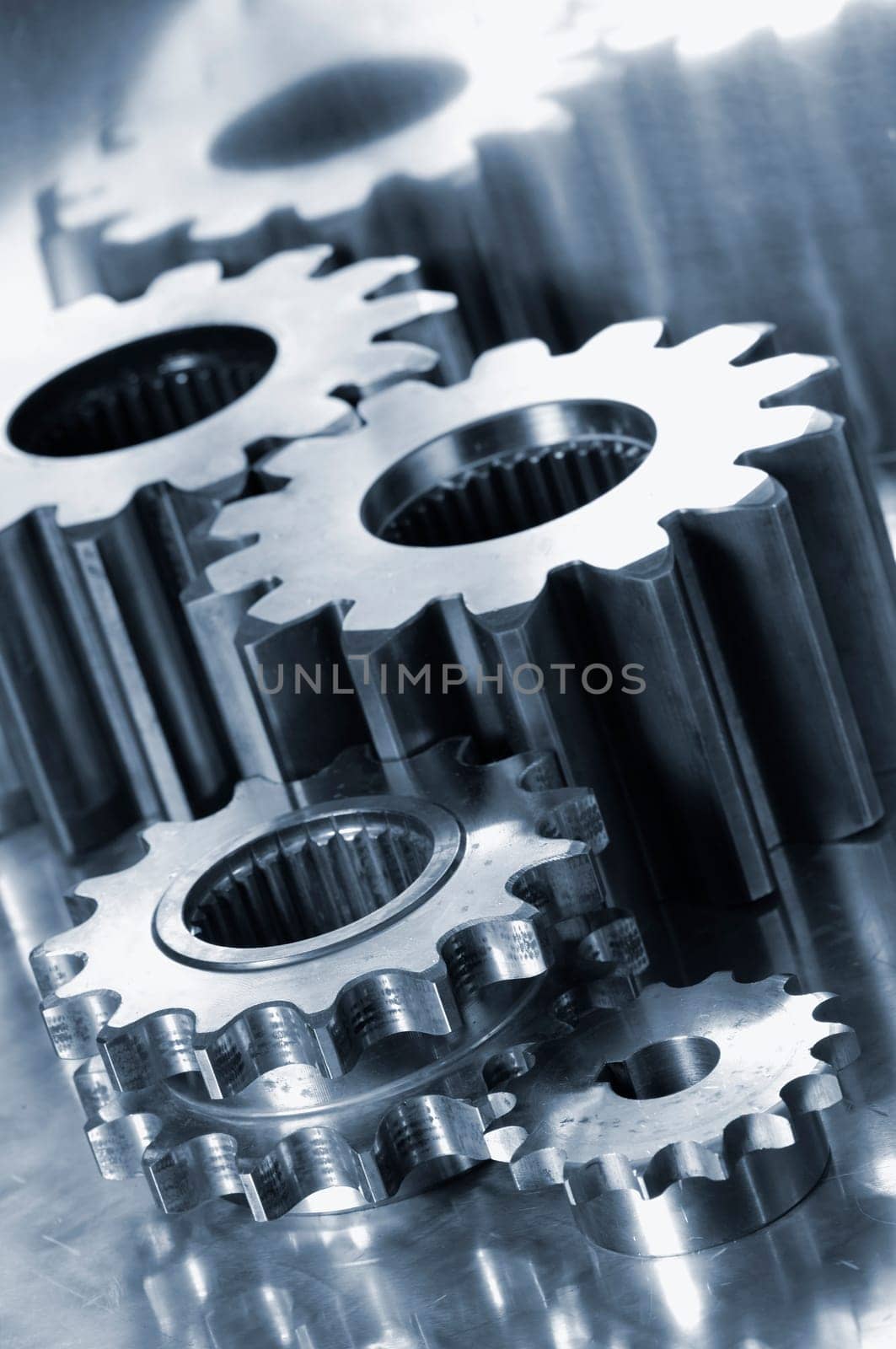 titanium gear wheels, aerospace industry, brushed aluminum background