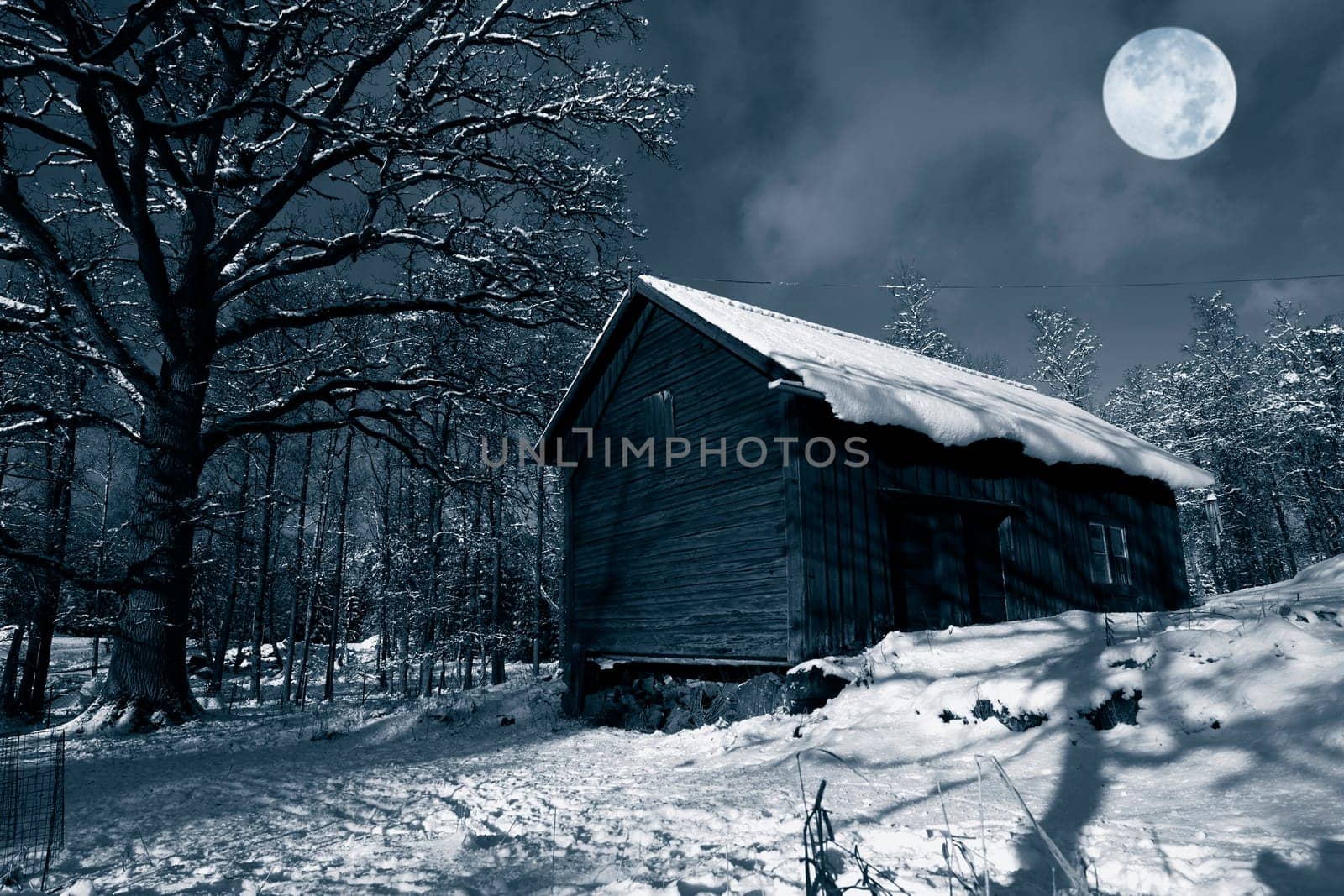 old-barn, surrounded by winter, snow and ice, full-moon casting a cold light