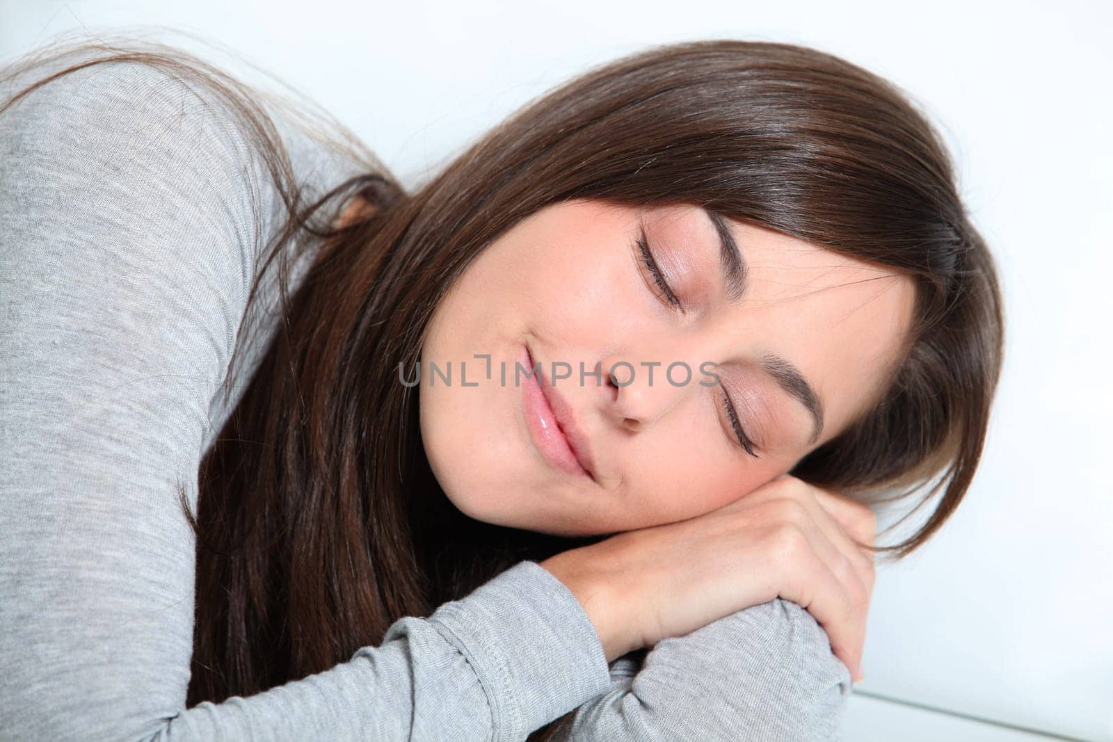 Closeup of young woman relaxing on sofa