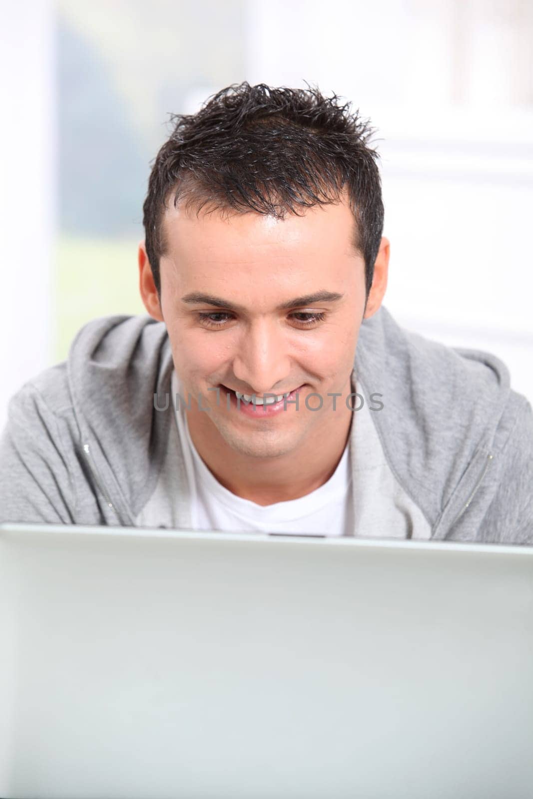 Young man using laptop computer