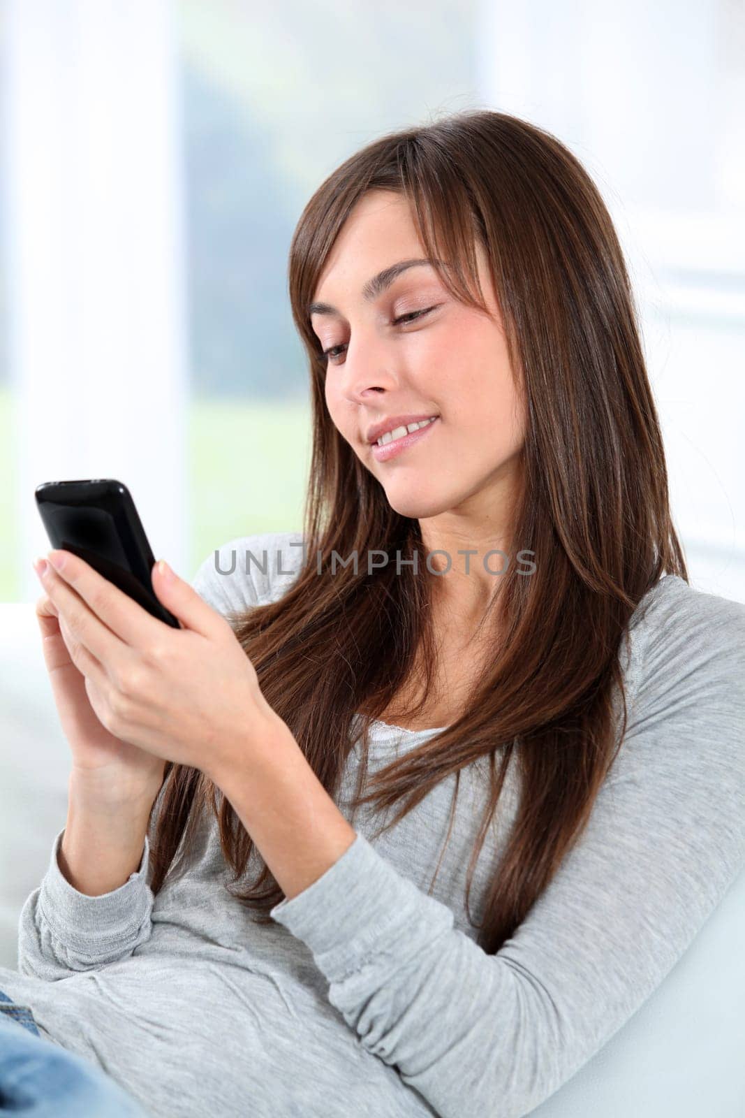 Beautiful young woman talking on mobile phone
