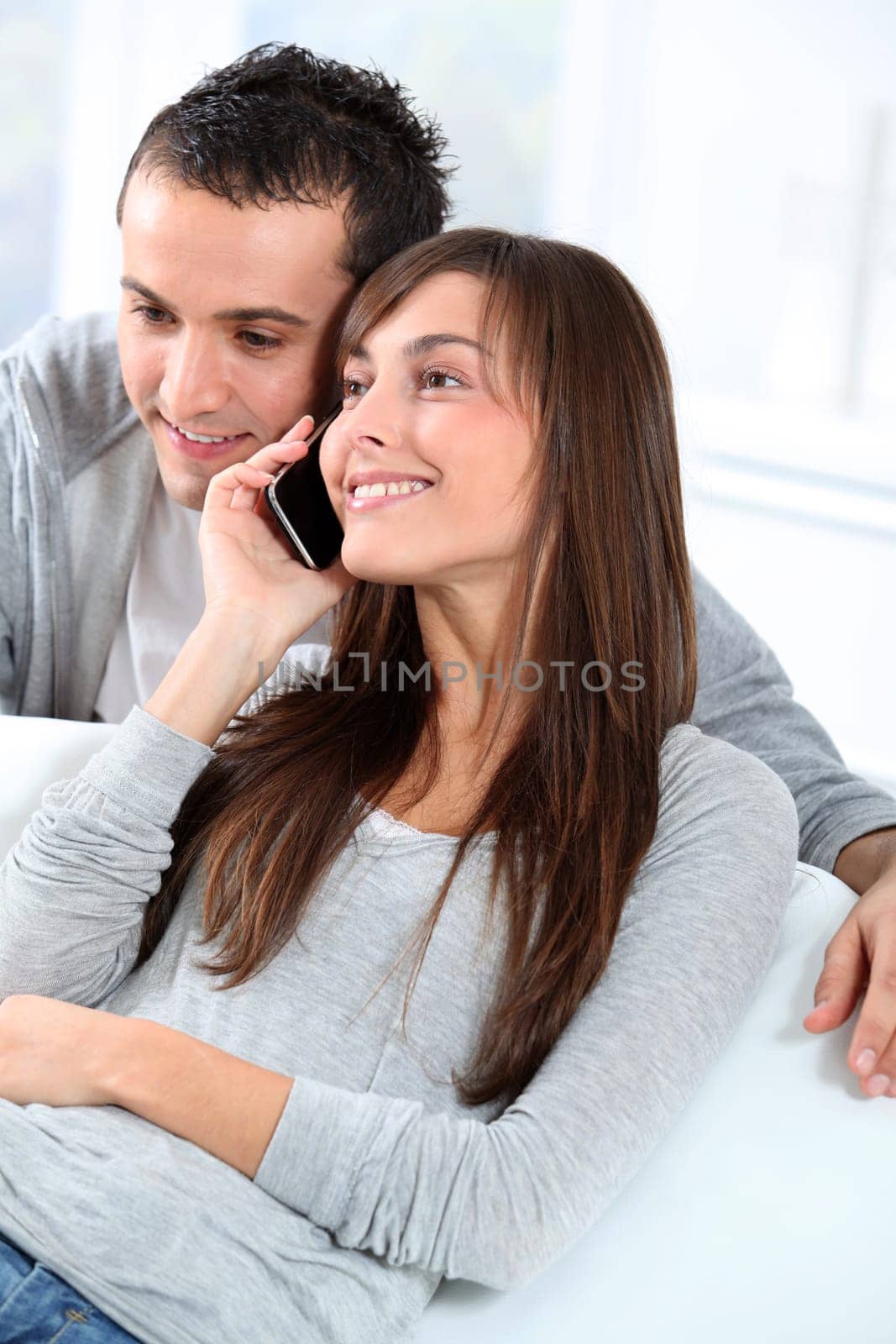 Young couple on telephone conversation