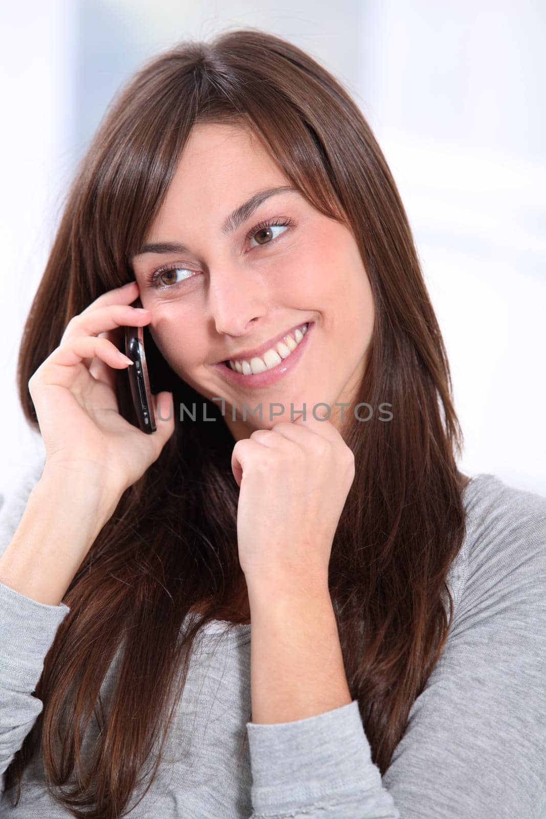 Beautiful young woman talking on mobile phone