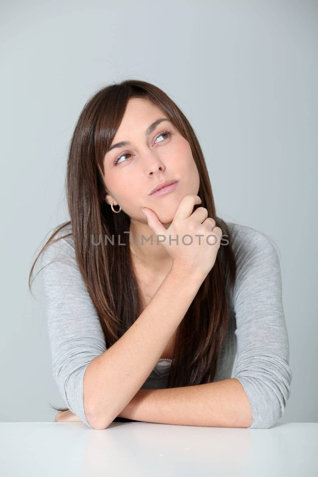 Closeup of young woman with doubtful look
