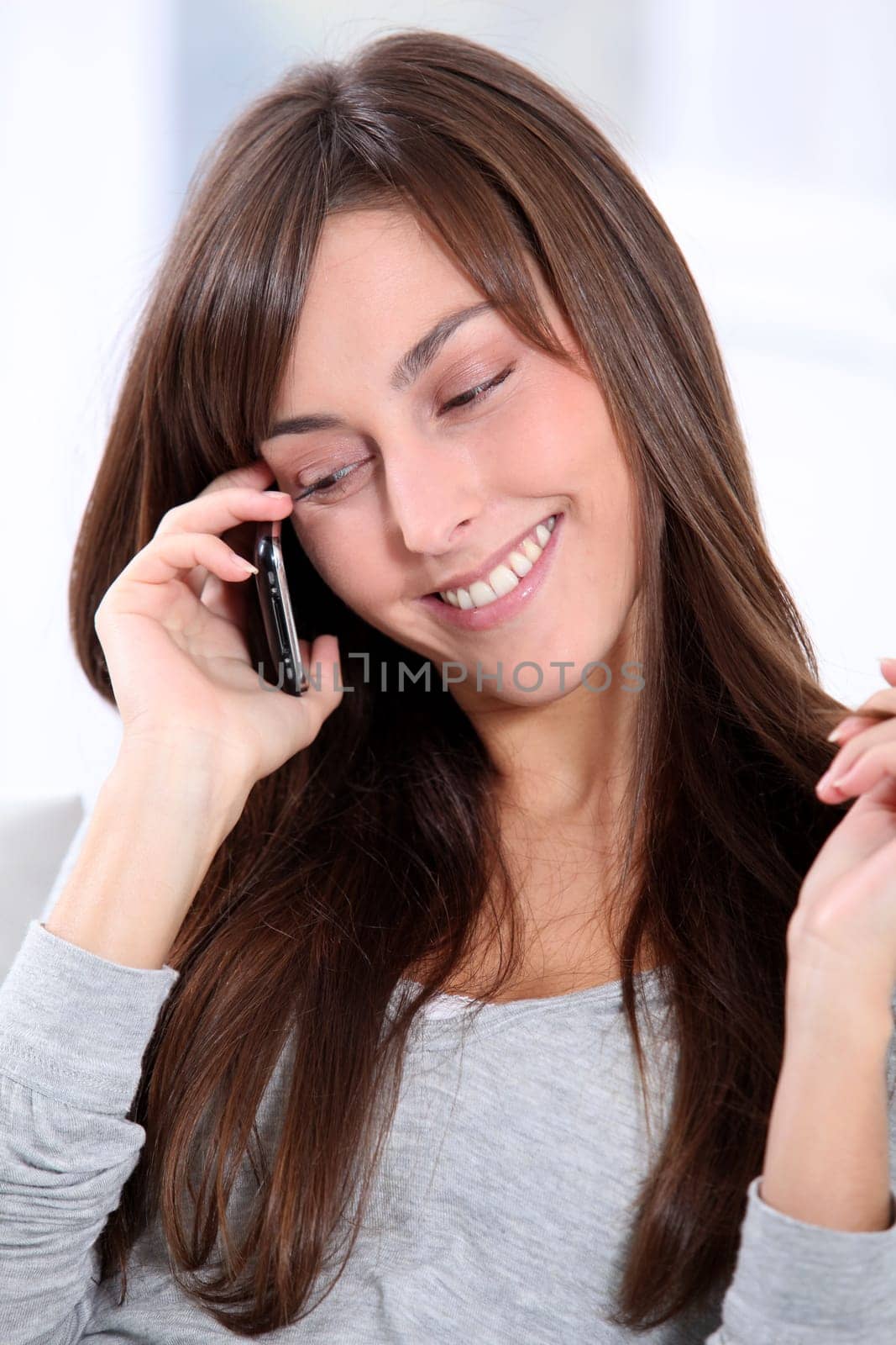 Beautiful young woman talking on mobile phone