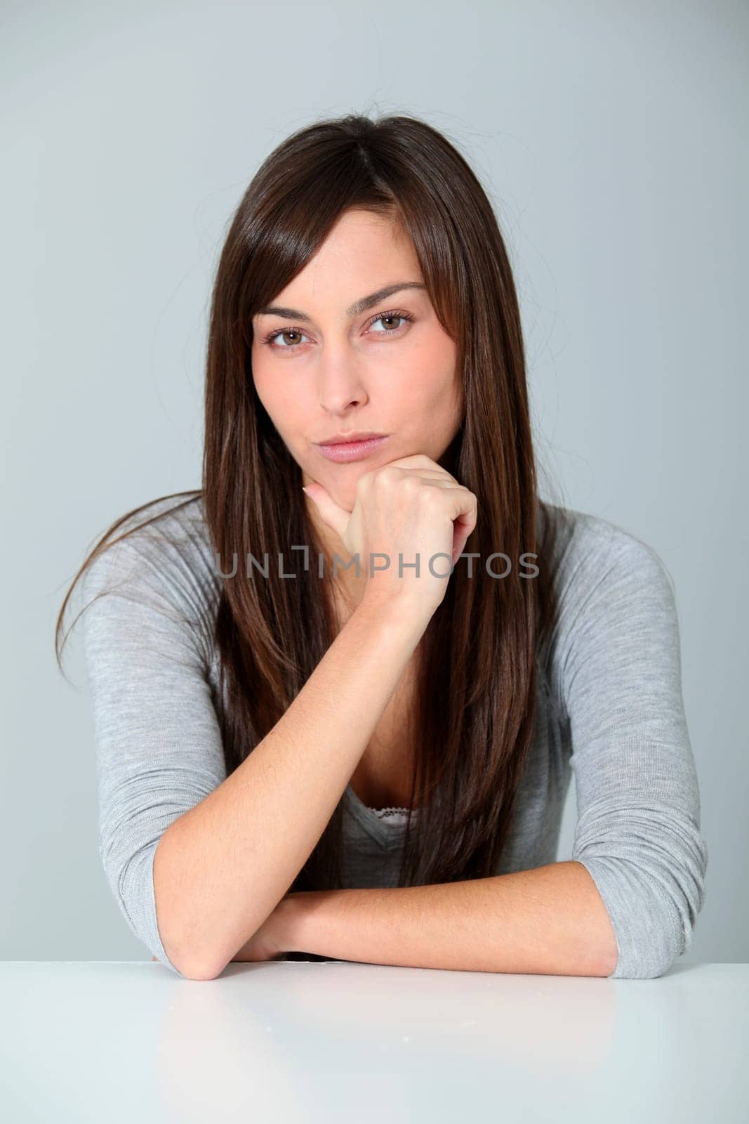 Closeup of young woman with doubtful look