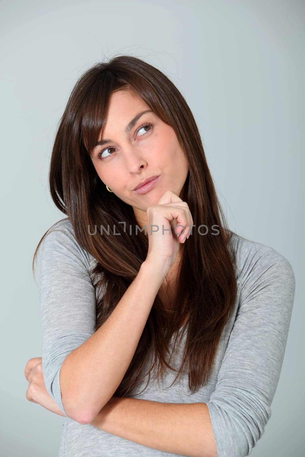 Closeup of young woman with doubtful look