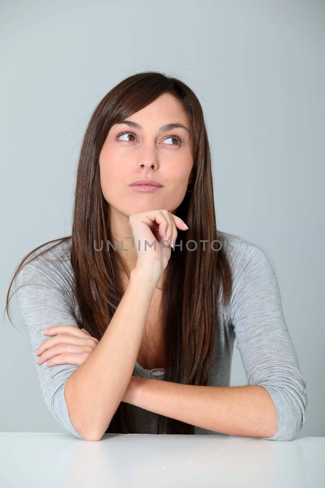 Closeup of young woman with doubtful look