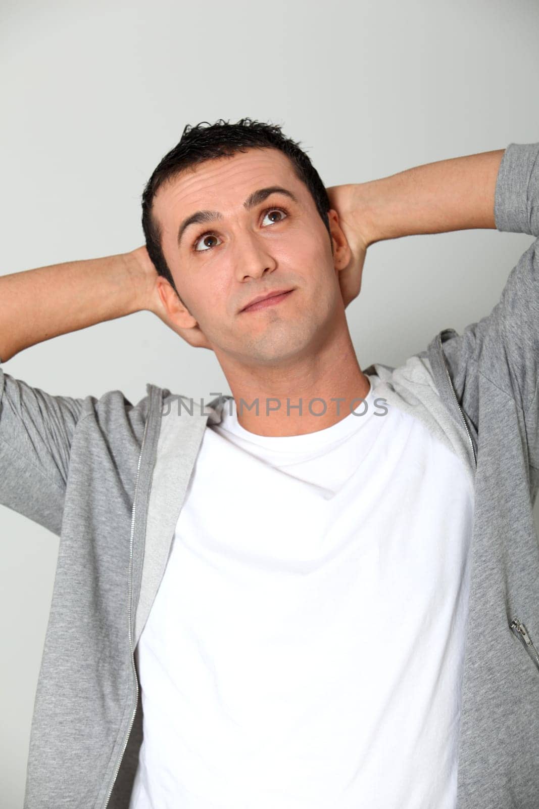 Closeup of young man looking up