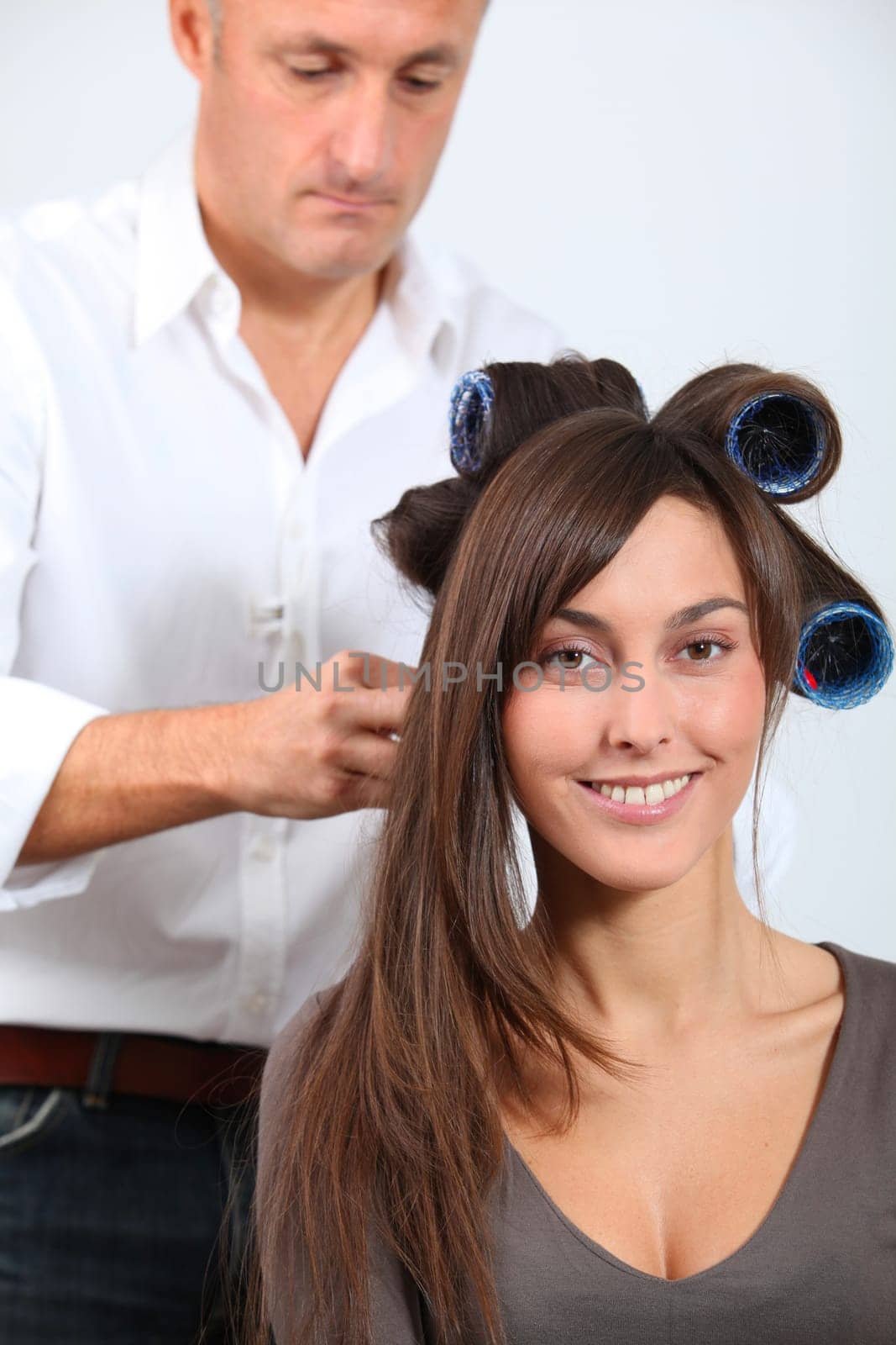 Woman getting hair-curlers