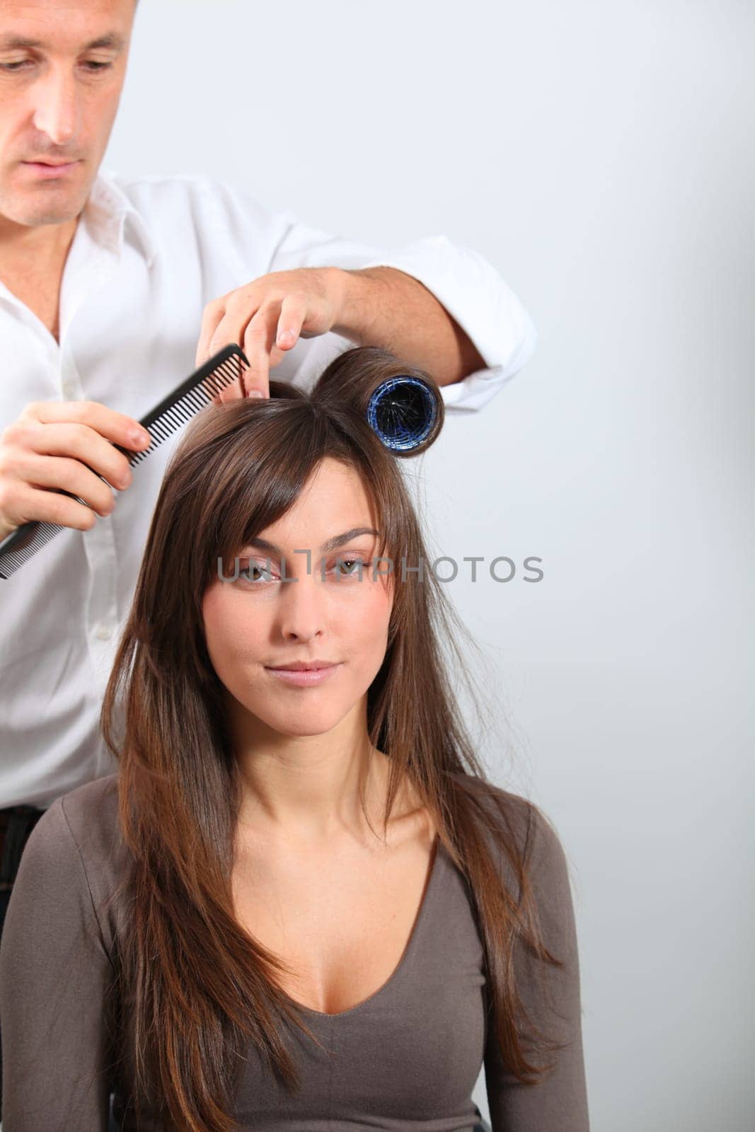 Woman getting hair-curlers