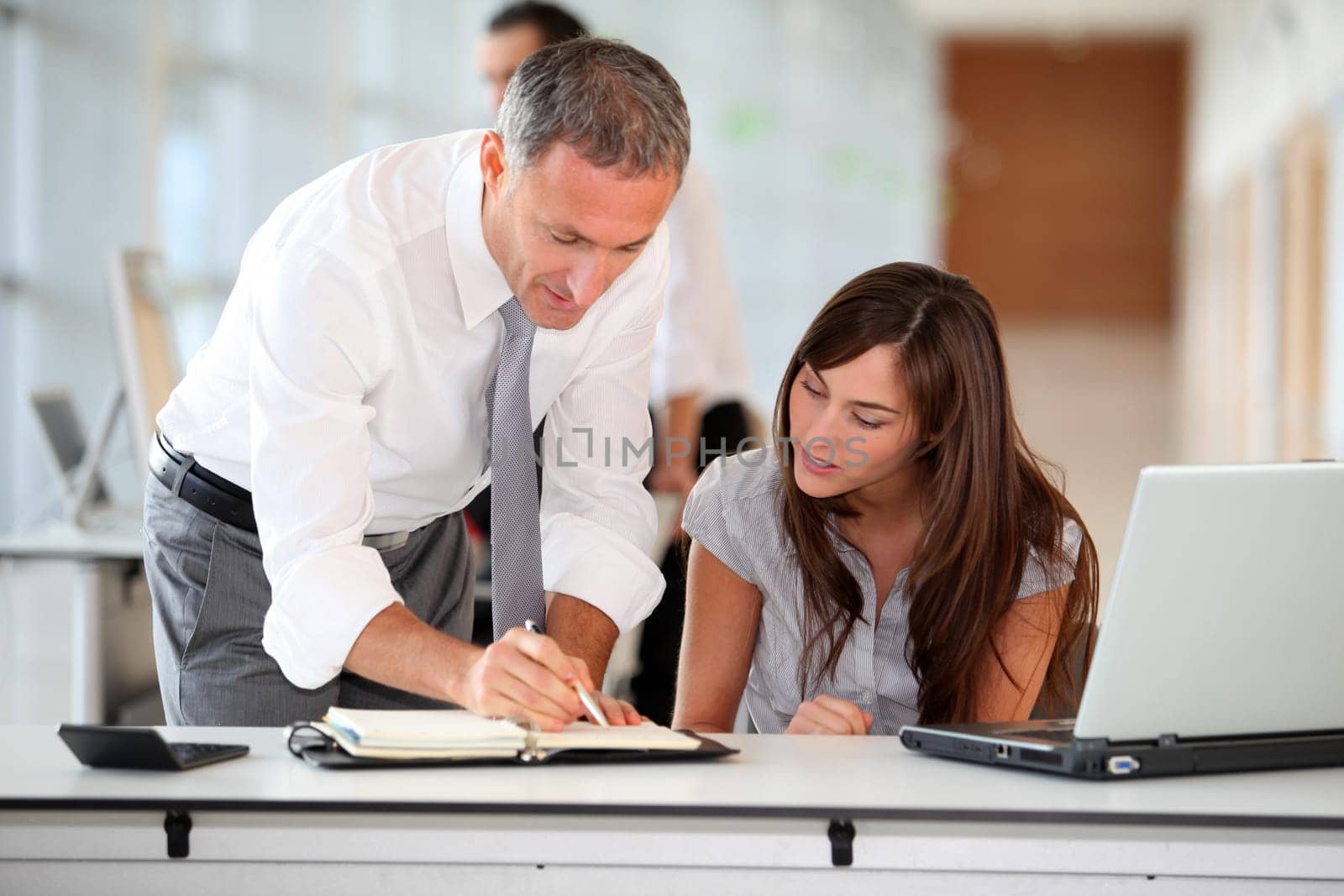 Manager and secretary working in the office