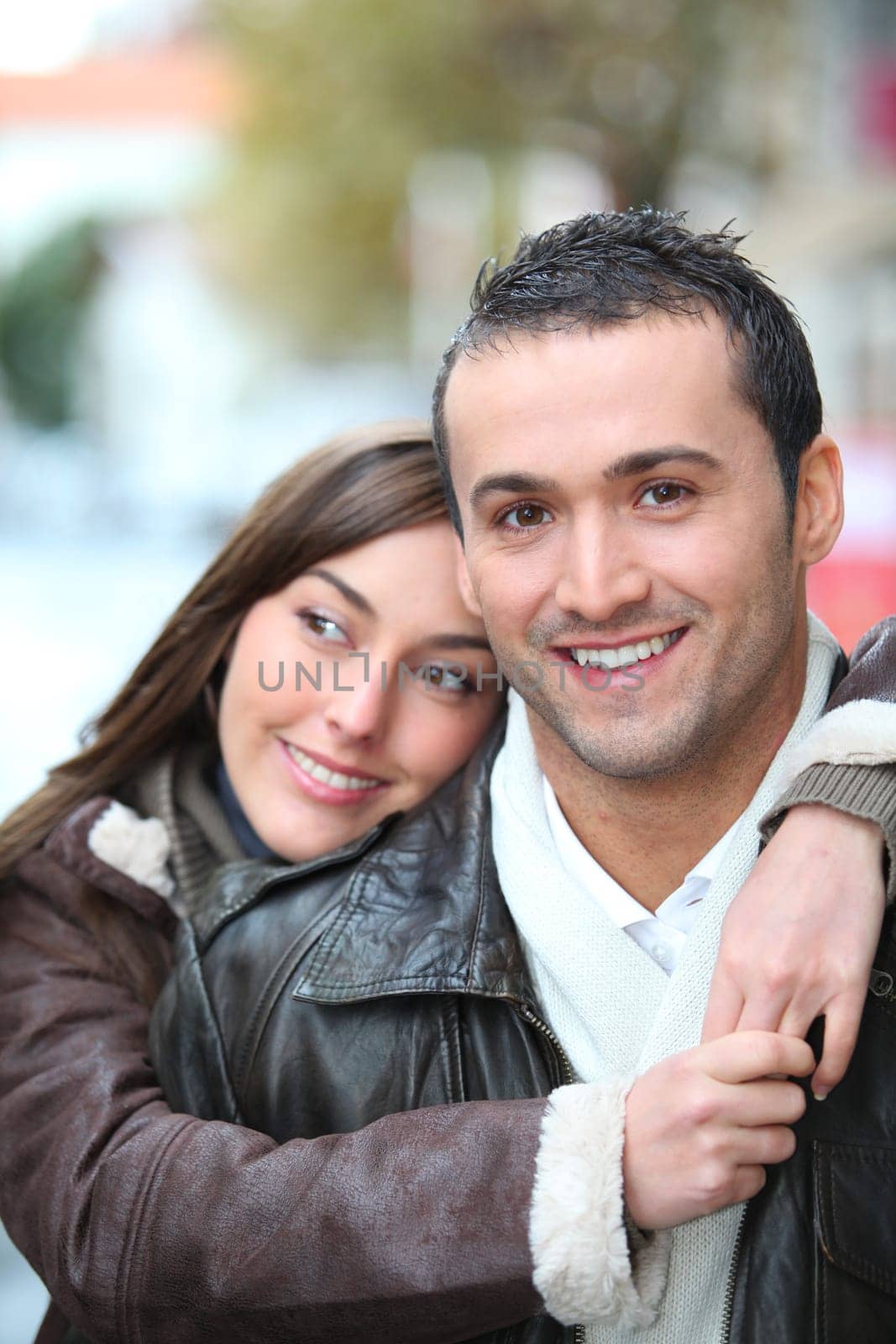 Young couple shopping in town in winter