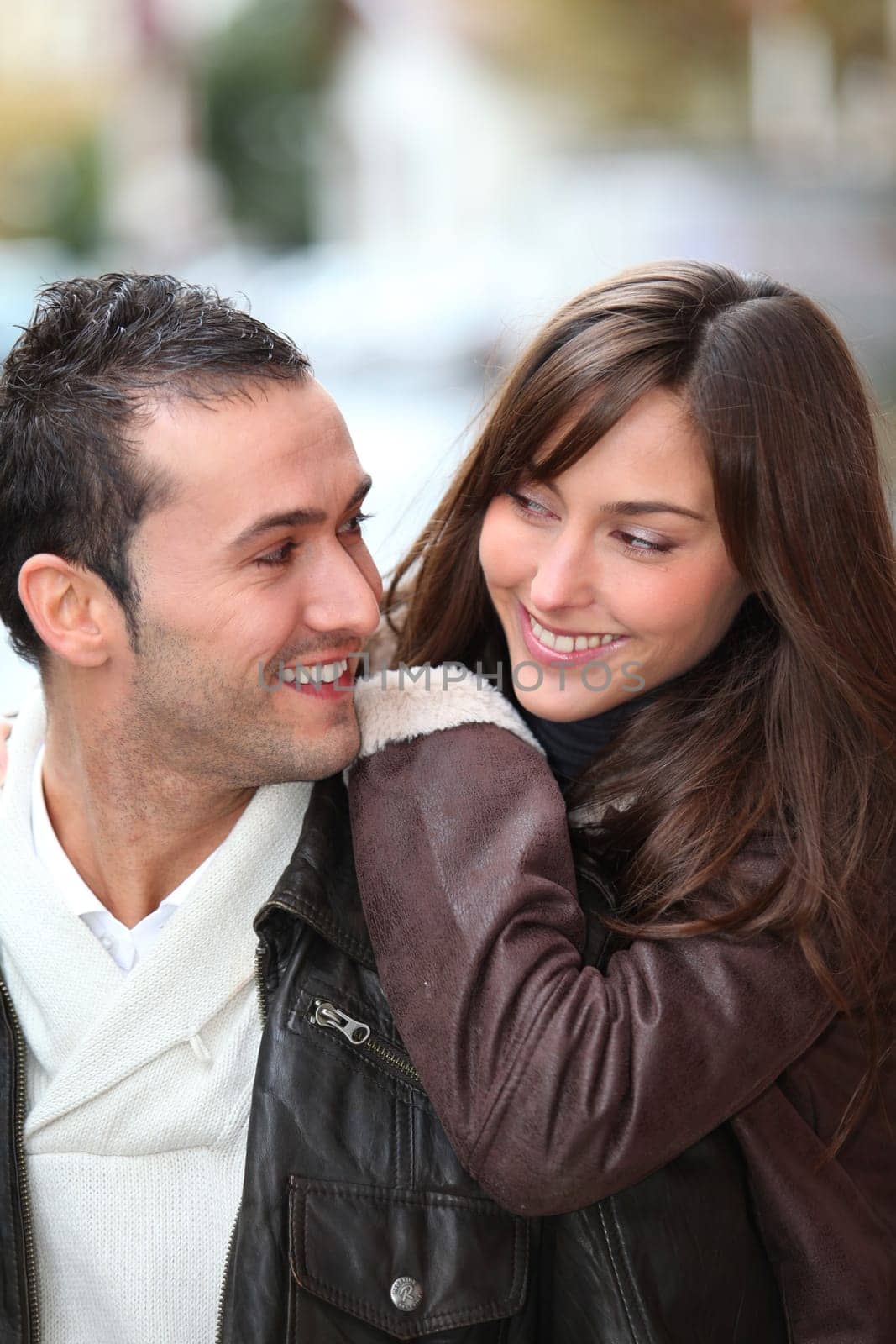 Young couple shopping in town in winter