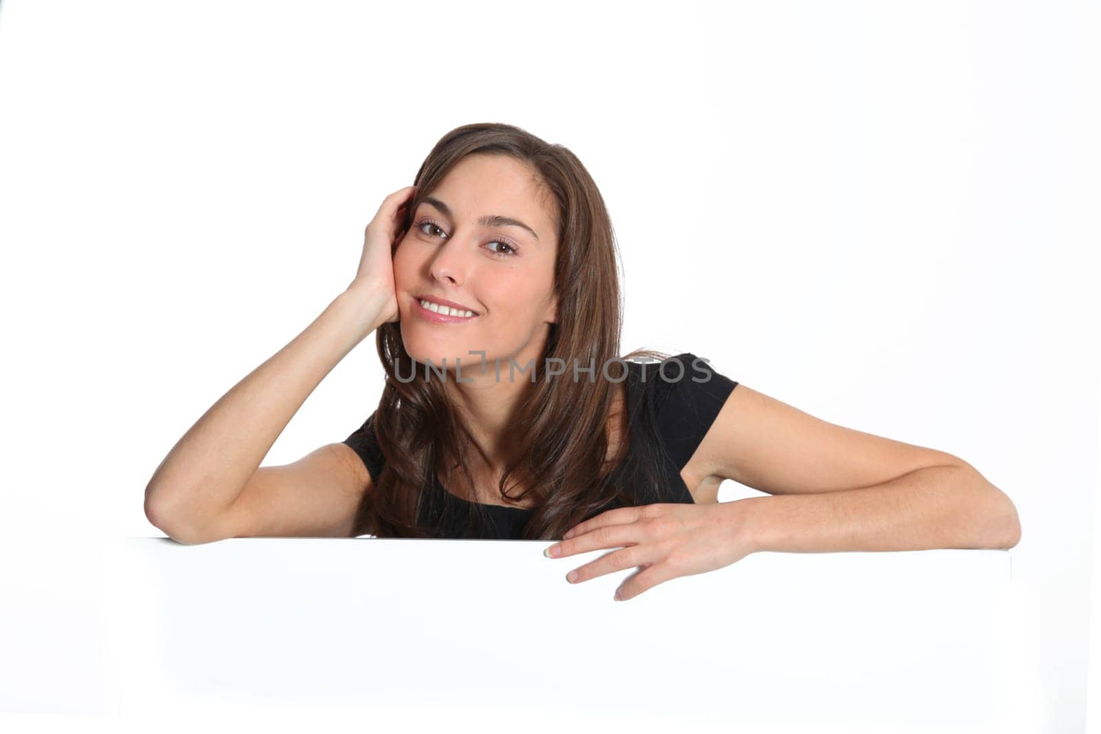 Woman in black dress showing message on white board