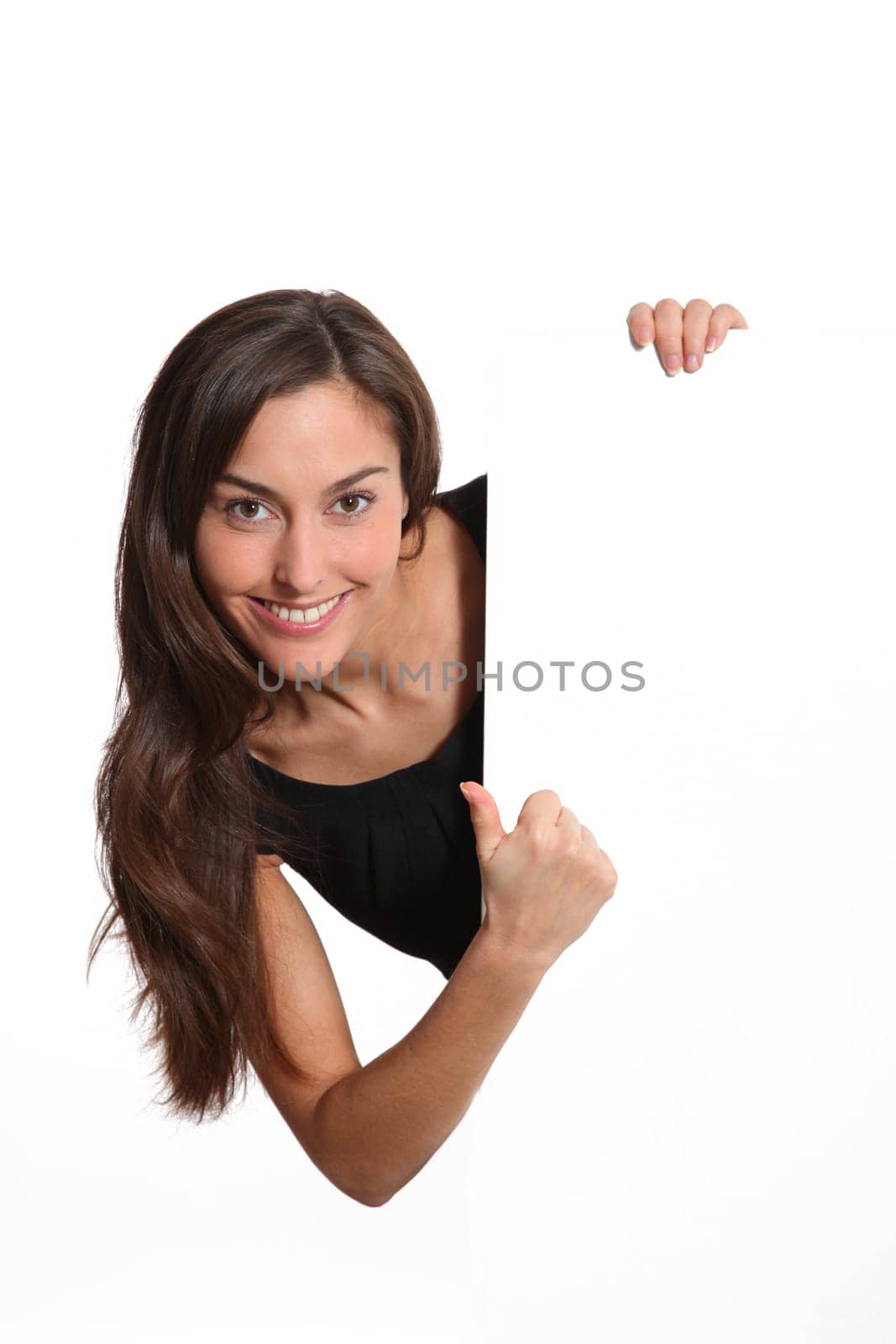Woman in black dress showing message on white board