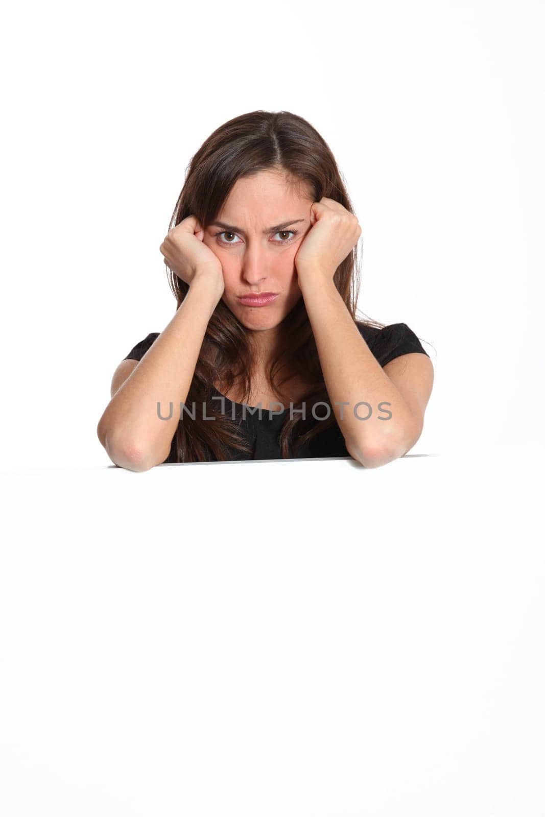 Woman with upset look on white background