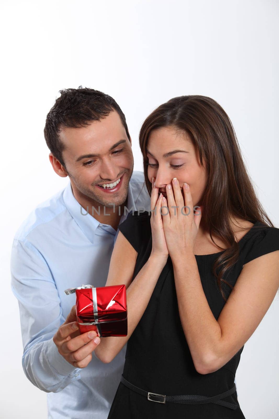 Man offering present to girlfriend