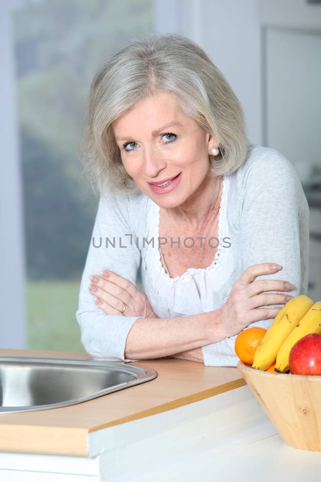 Senior woman standing in kitchen