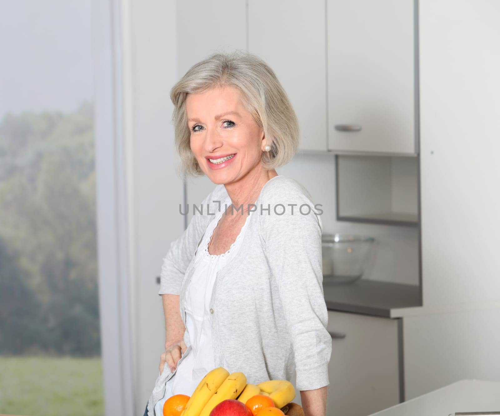 Senior woman standing in kitchen
