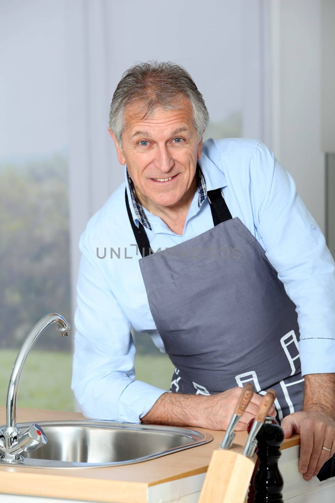 Closeup of senior man in home kitchen