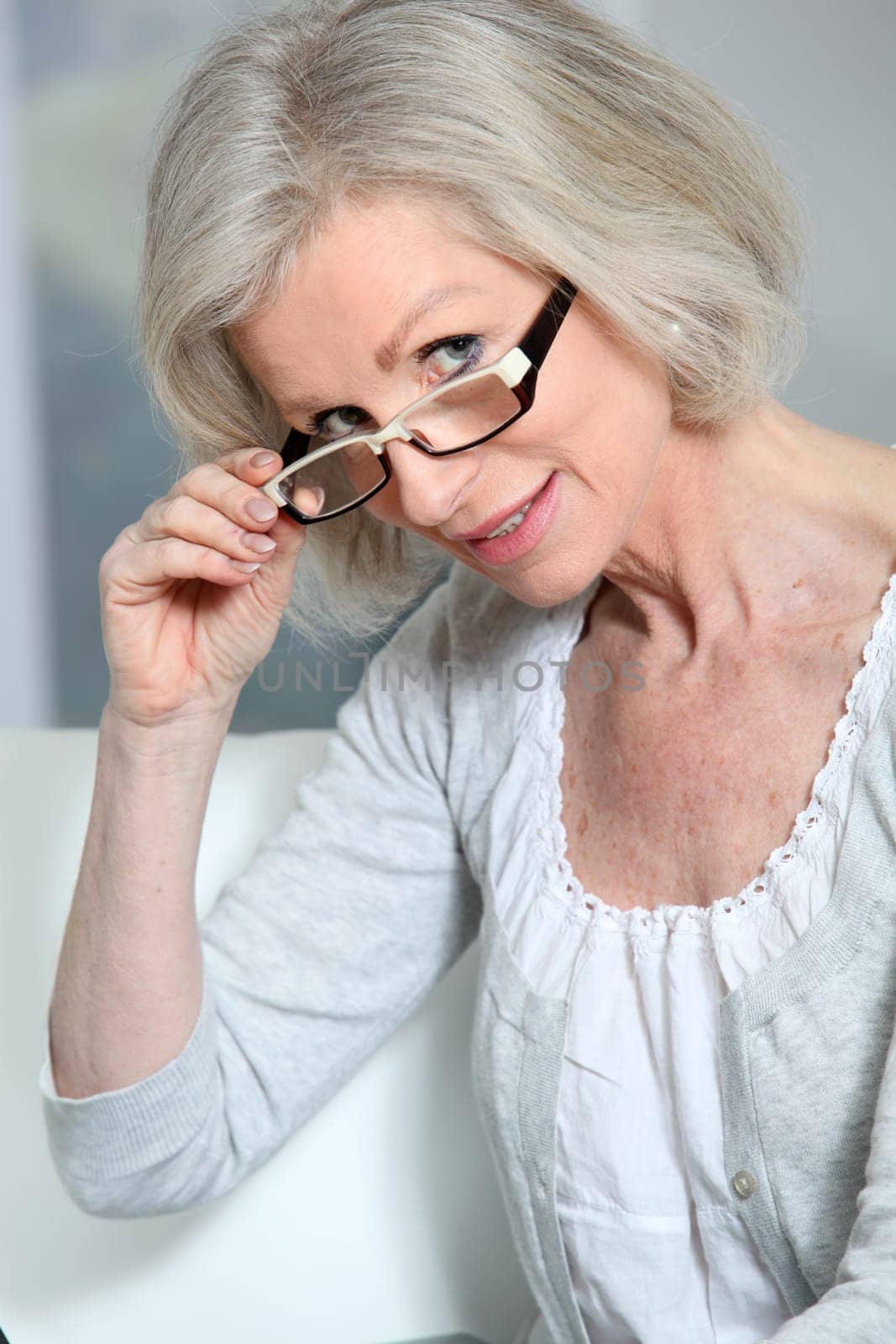 Portrait of senior woman wearing eyeglasses