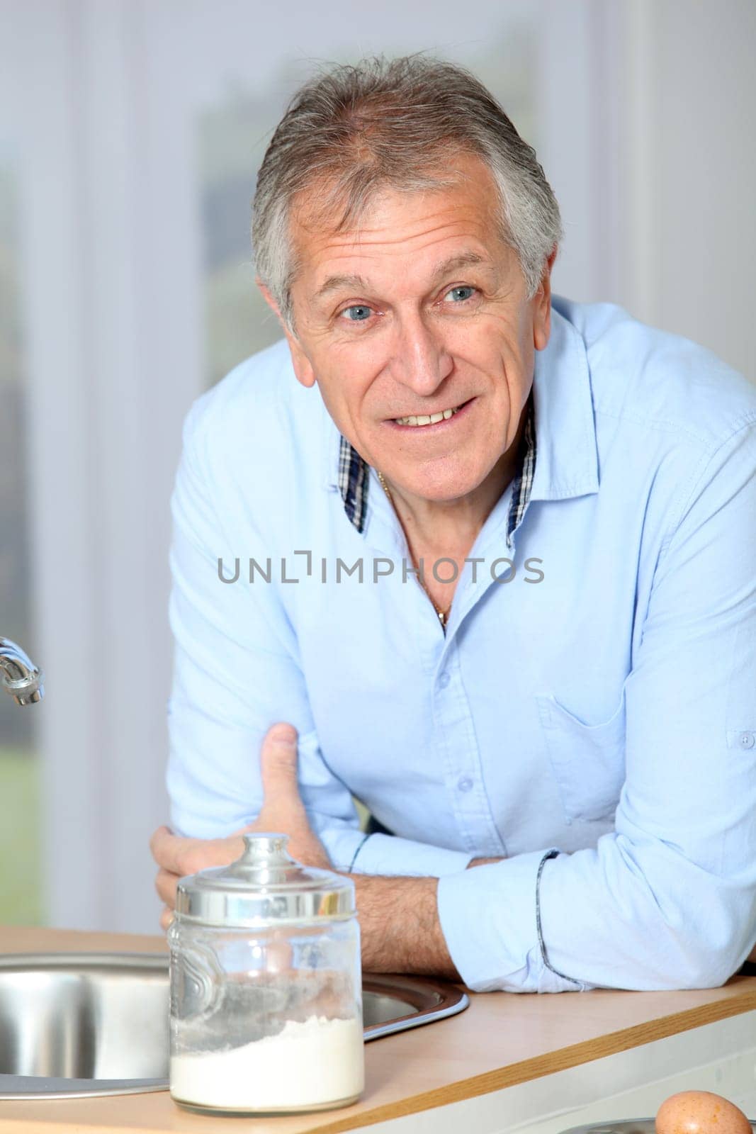 Closeup of senior man in home kitchen