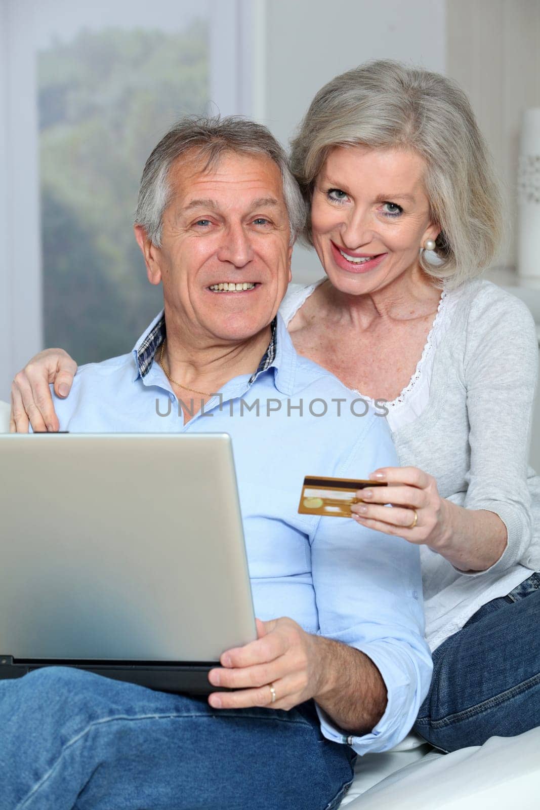 Senior couple doing online shopping