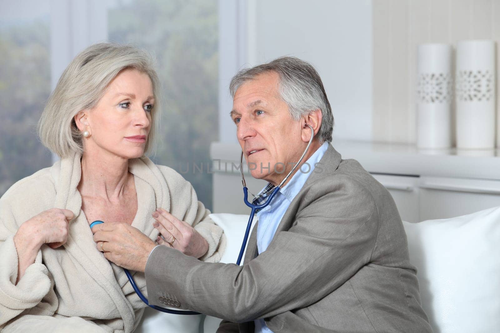 Doctor visiting patient at home
