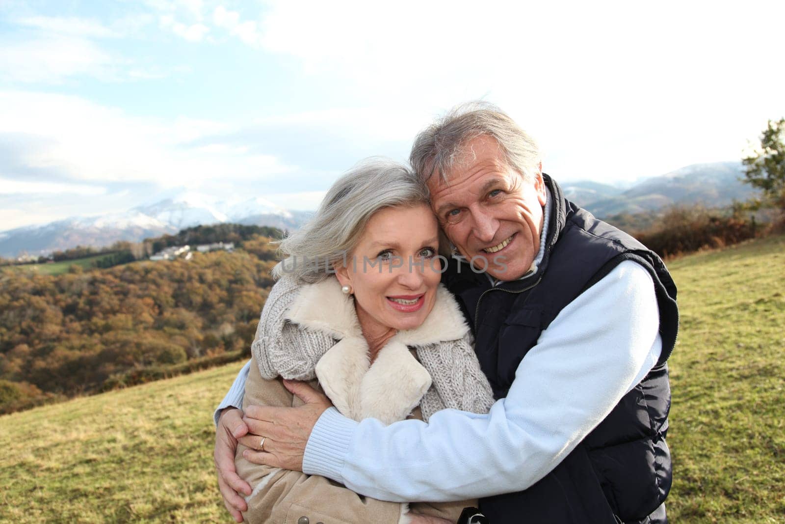 Portrait of happy senior couple in countryside