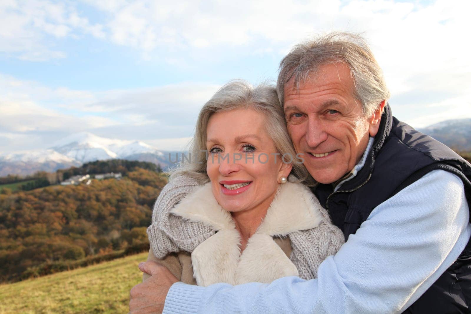 Portrait of happy senior couple in countryside