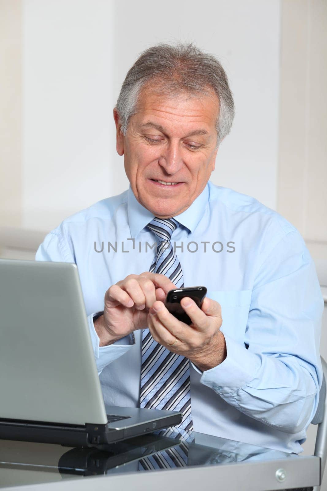 Portrait of senior businessman in office