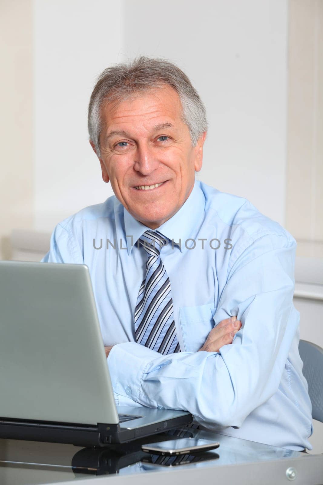 Portrait of senior businessman in office