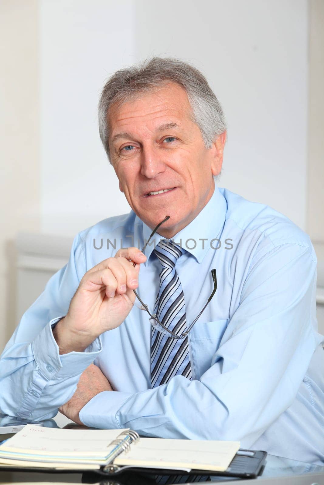 Portrait of senior businessman in office