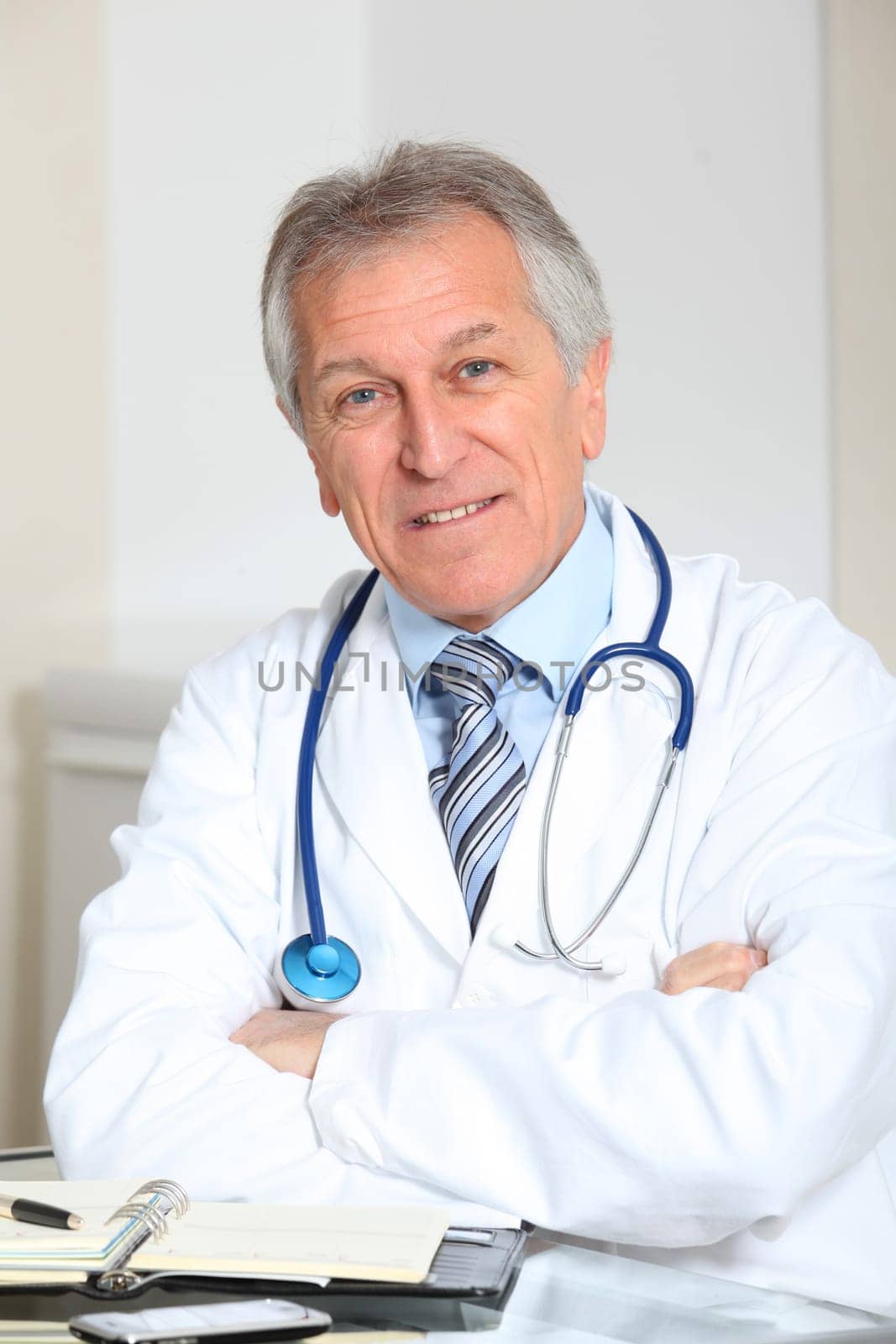 Closeup of doctor in the office with arms crossed