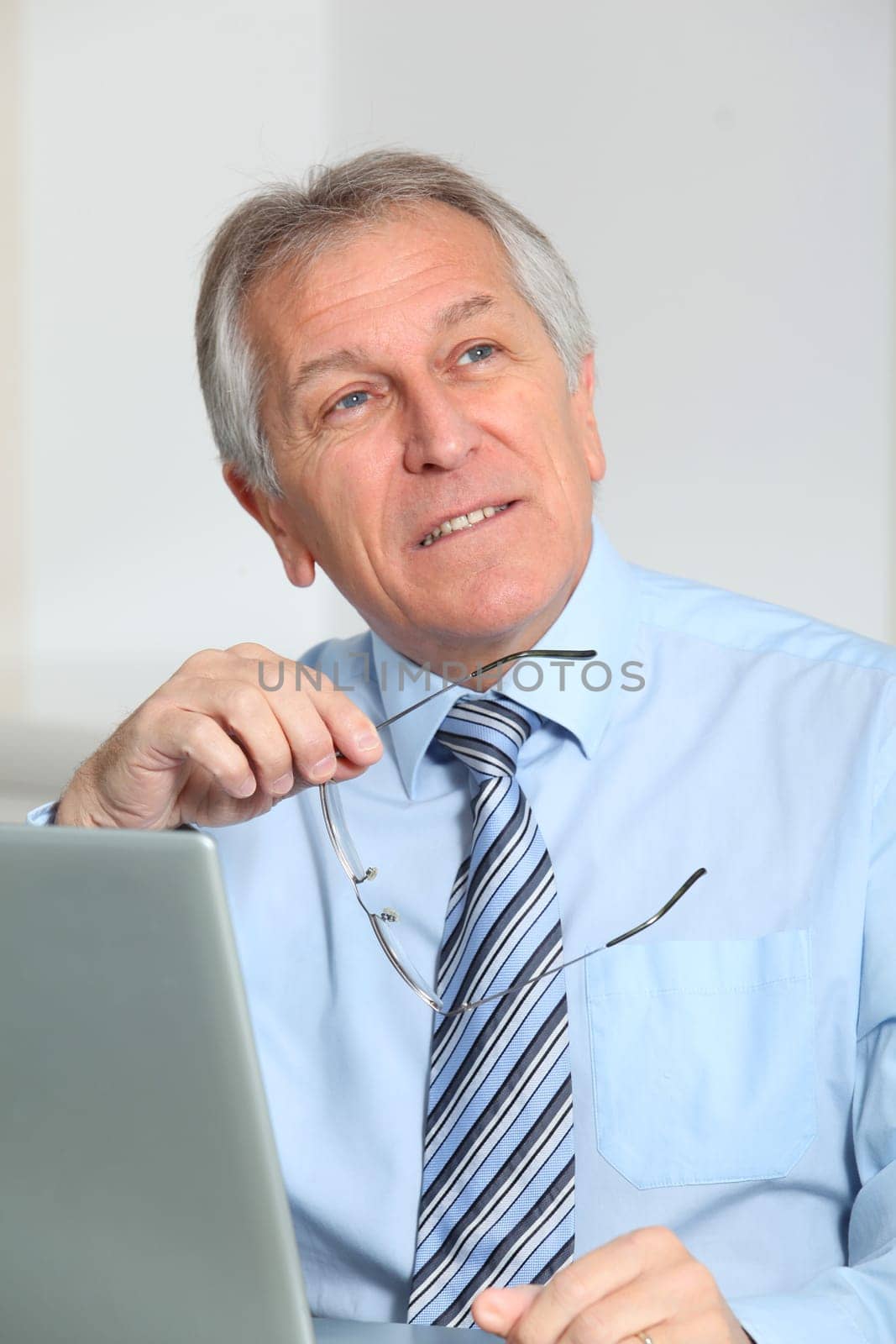Portrait of senior businessman in office