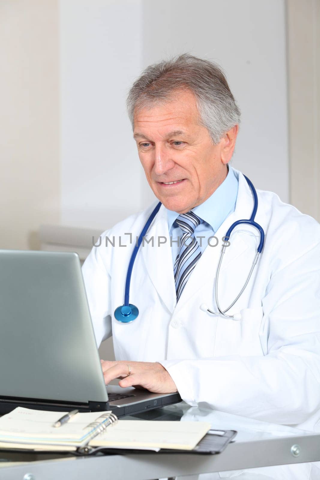 Closeup of doctor working on computer in the office